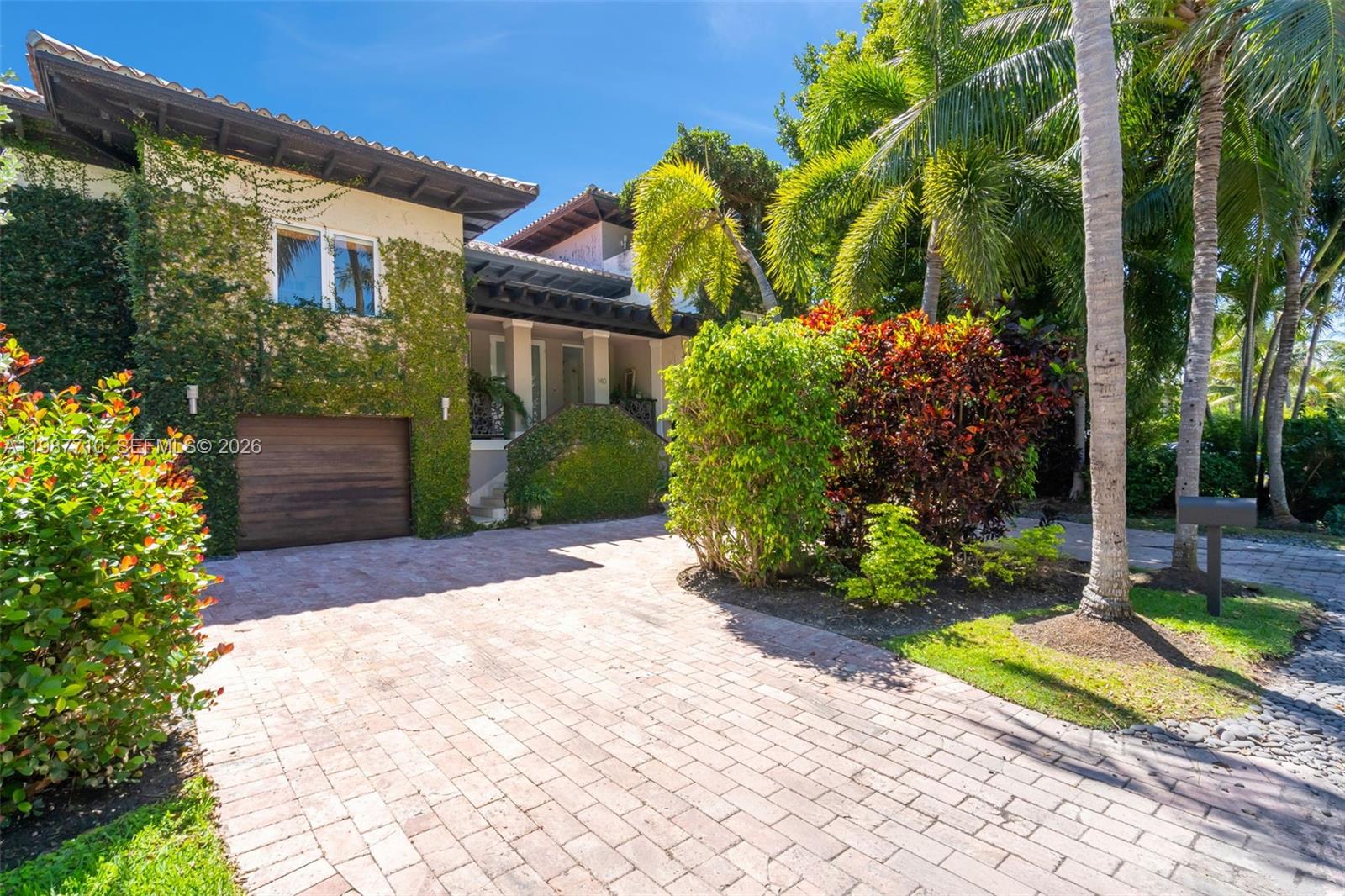 140 Hampton Lane Key Biscayne, FL 33149 - Photo 40 of 43 a view of a house with a yard and plants