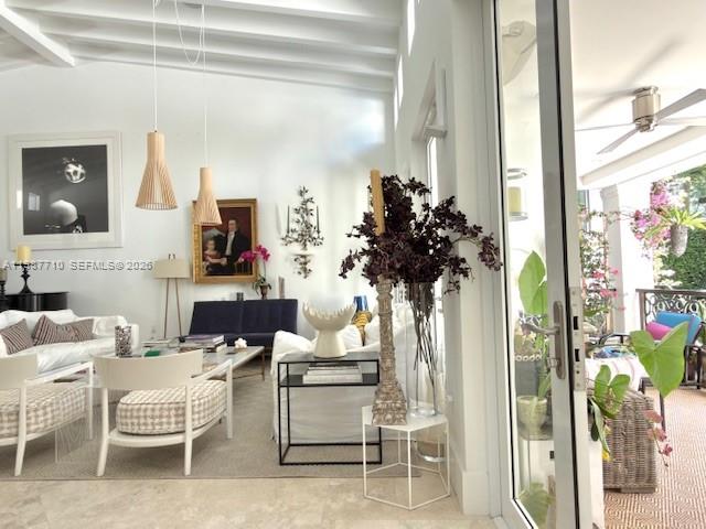 140 Hampton Lane Key Biscayne, FL 33149 - Photo 6 of 44 The living room is adjacent to the terrace, and the picture captures both the interior and exterior of the house.