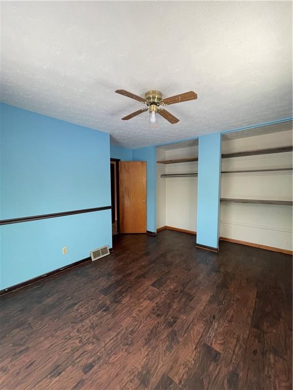 827 Georgetown Road Sandy Lake, PA 16145 - Photo 11 of 20 a view of room with hardwood floor and a ceiling fan