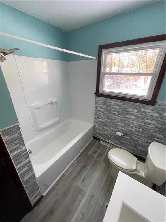 827 Georgetown Road Sandy Lake, PA 16145 - Photo 12 of 20 a bathroom with a toilet a sink and bathtub