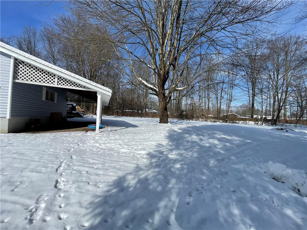 827 Georgetown Road Sandy Lake, PA 16145 - Photo 19 of 20 a view of a house with a snow in the yard