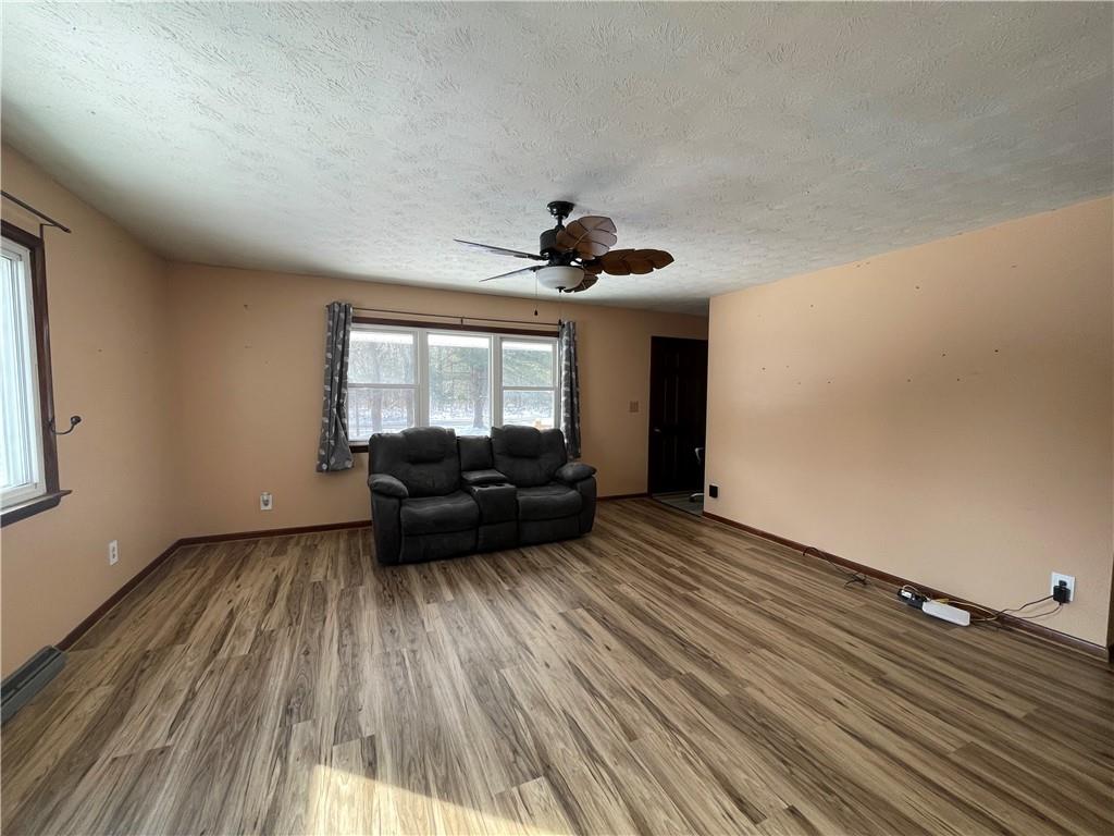 827 Georgetown Road Sandy Lake, PA 16145 - Photo 8 of 20 a living room with furniture and a large window