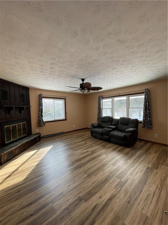 827 Georgetown Road Sandy Lake, PA 16145 - Photo 9 of 20 a view of a room with wooden floor and windows