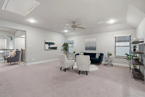 a living room with furniture and a table