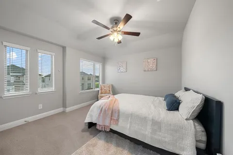 a bedroom with a bed and window
