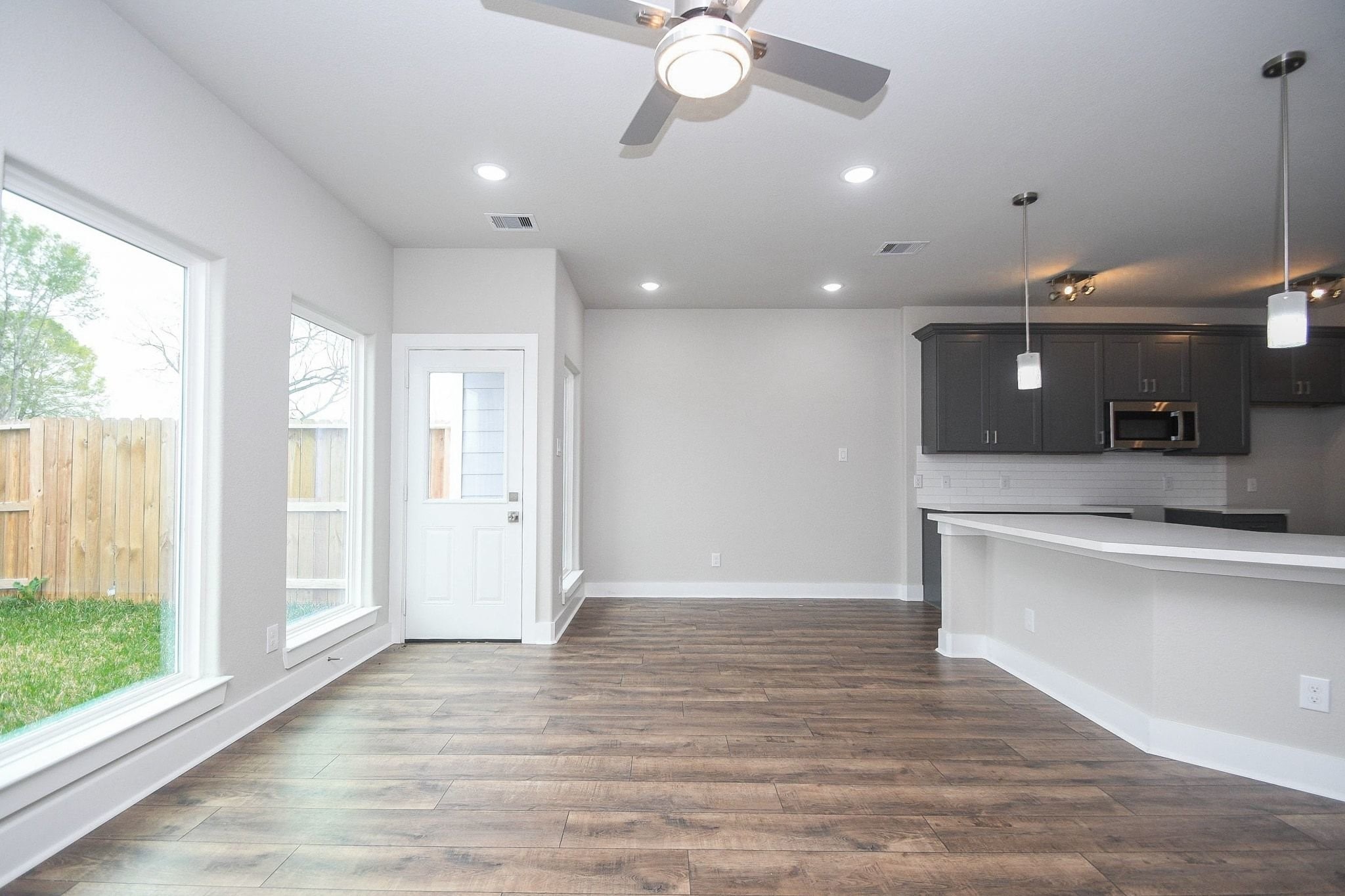 4401 Alvin Street, Unit B Houston, TX 77051 - Photo 4 of 19 a view of counter top space with wooden floor and fan