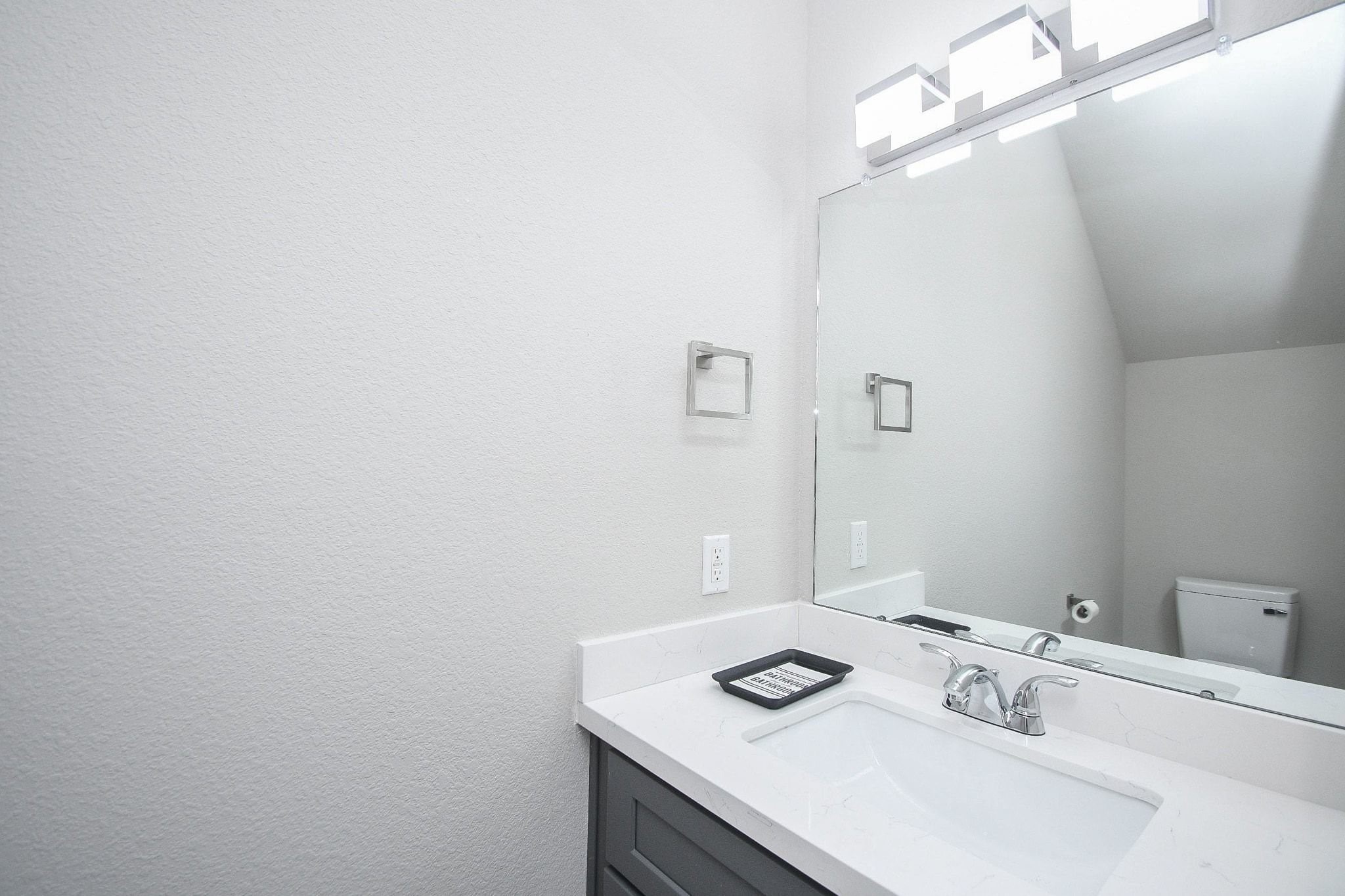 4401 Alvin Street, Unit B Houston, TX 77051 - Photo 8 of 19 a bathroom with a sink and a mirror