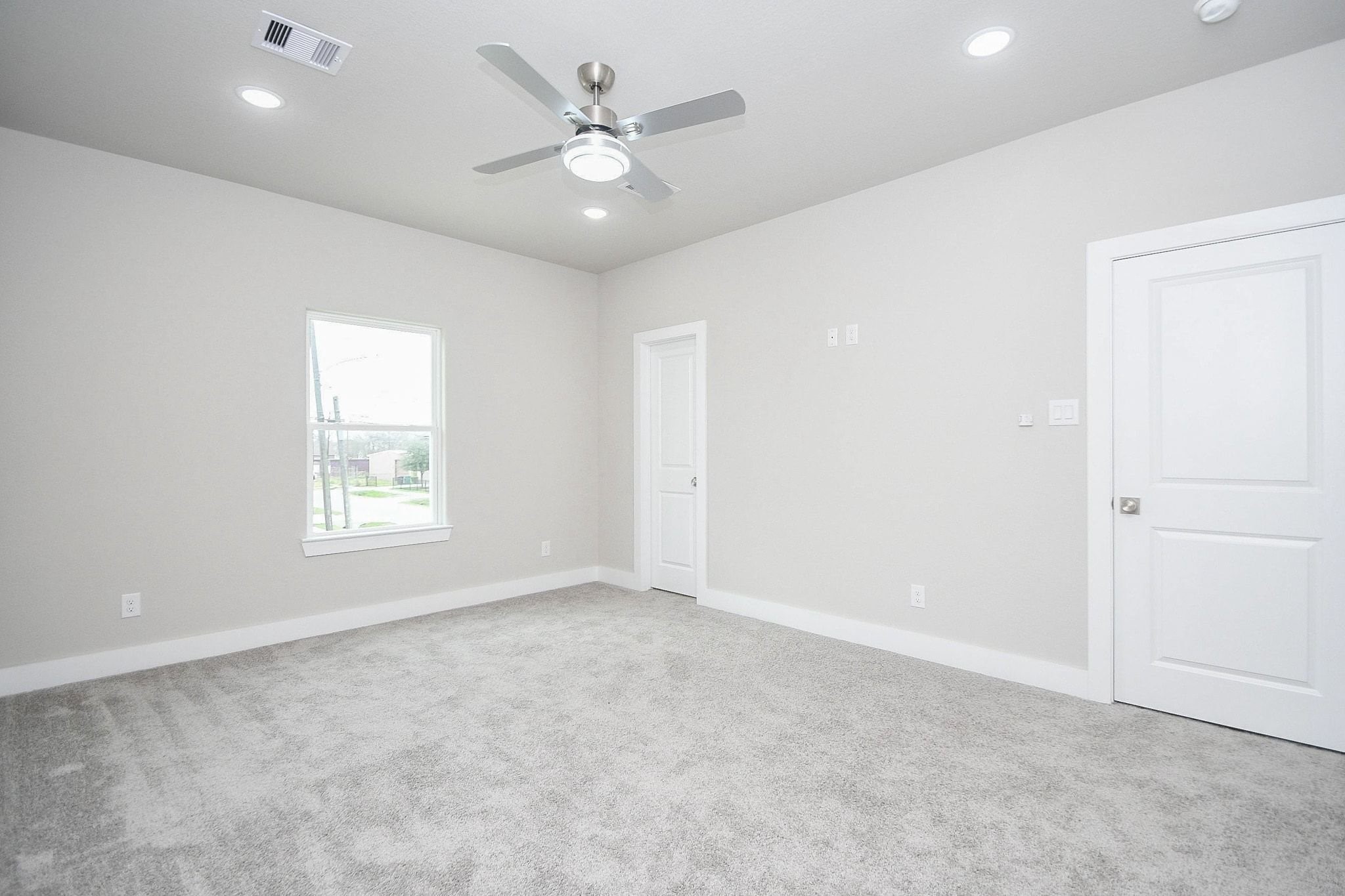 4401 Alvin Street, Unit B Houston, TX 77051 - Photo 10 of 19 an empty room with windows and fan