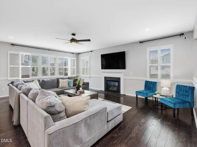 a kitchen with center island table and chairs