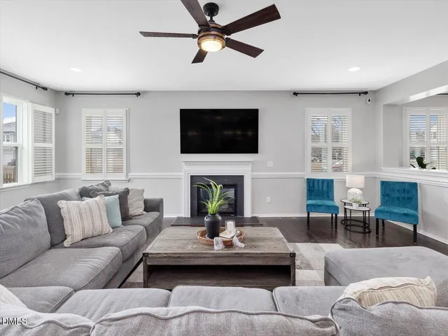 a kitchen with granite countertop a kitchen island a sink stainless steel appliances and cabinets