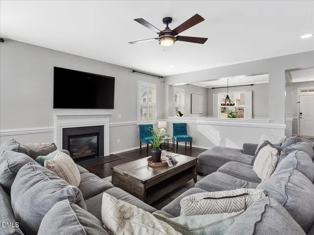 a kitchen with granite countertop a sink and a refrigerator