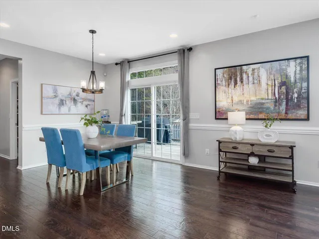 a utility room with lots of clutter and cabinets