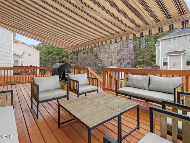 a bathroom with a granite countertop sink and a bathtub