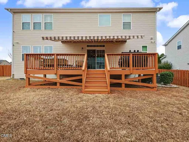 a bedroom with a bed and a ceiling fan