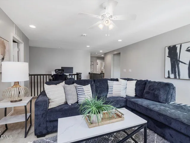 a utility room with wooden floor washer and dryer