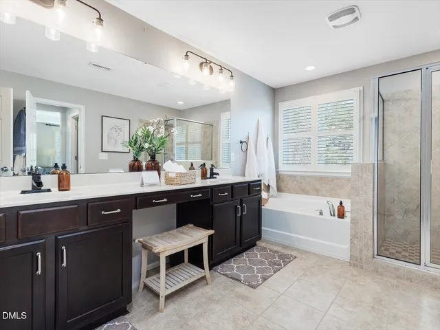 a view of a swimming pool with lawn chairs and a big yard