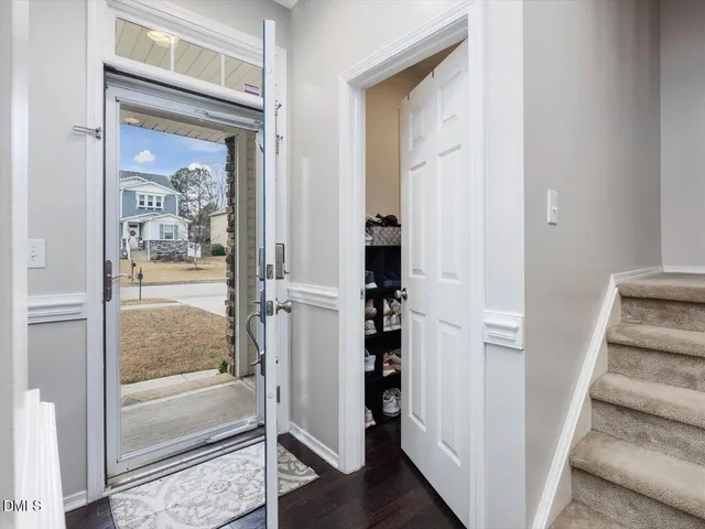 a living room with furniture fireplace and a flat screen tv