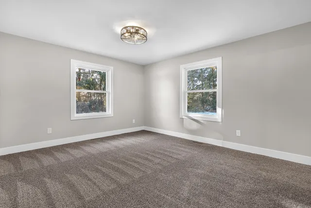 an empty room with windows