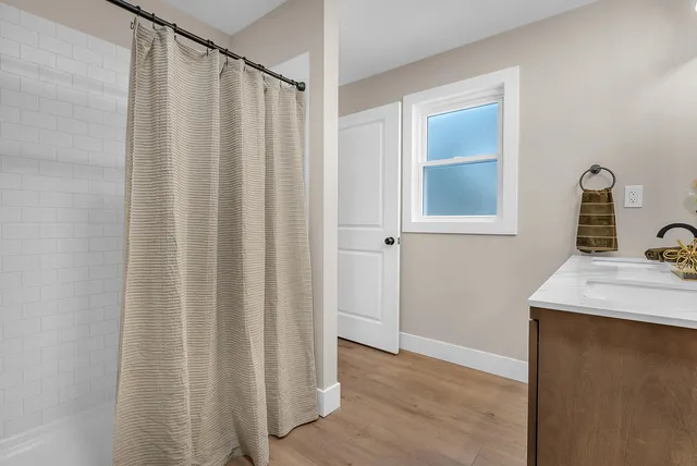 a bathroom with a sink and a mirror