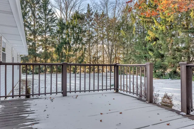 a view of entryway gate and wooden fence