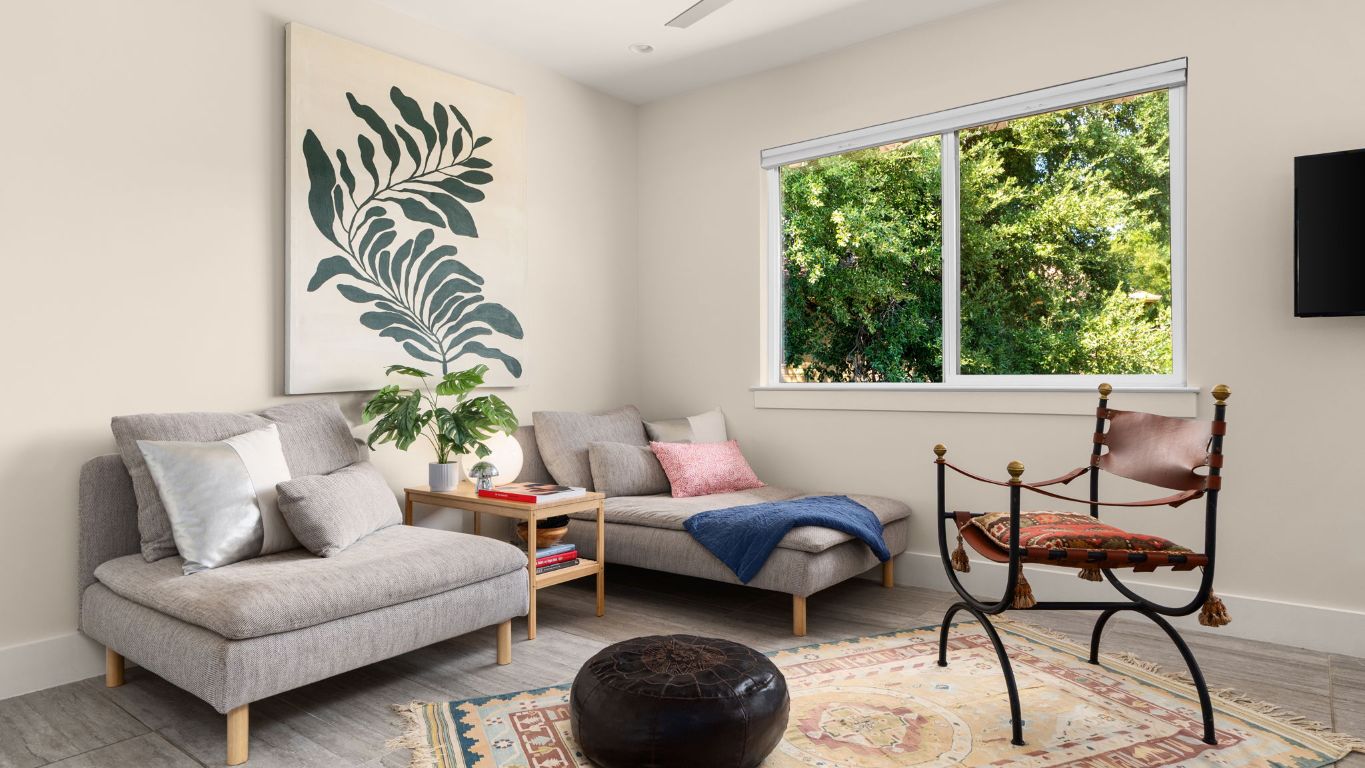 a living room with furniture and a large window