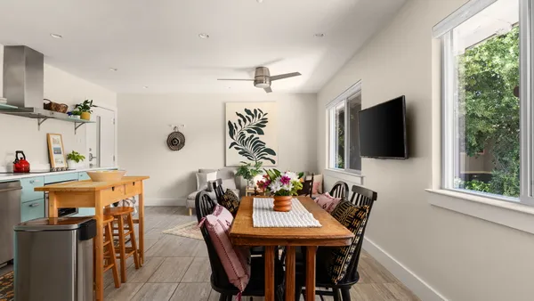 a view of a dining room with furniture window and outside view