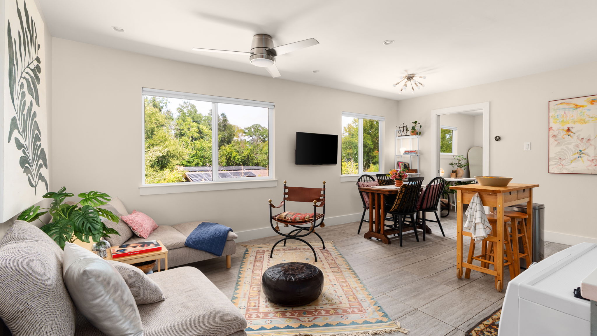 1208 Enfield Road, Unit 204 Austin, TX 78703 - Photo 3 of 21 a living room with furniture and a flat screen tv