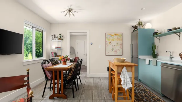 a dining room with furniture and window