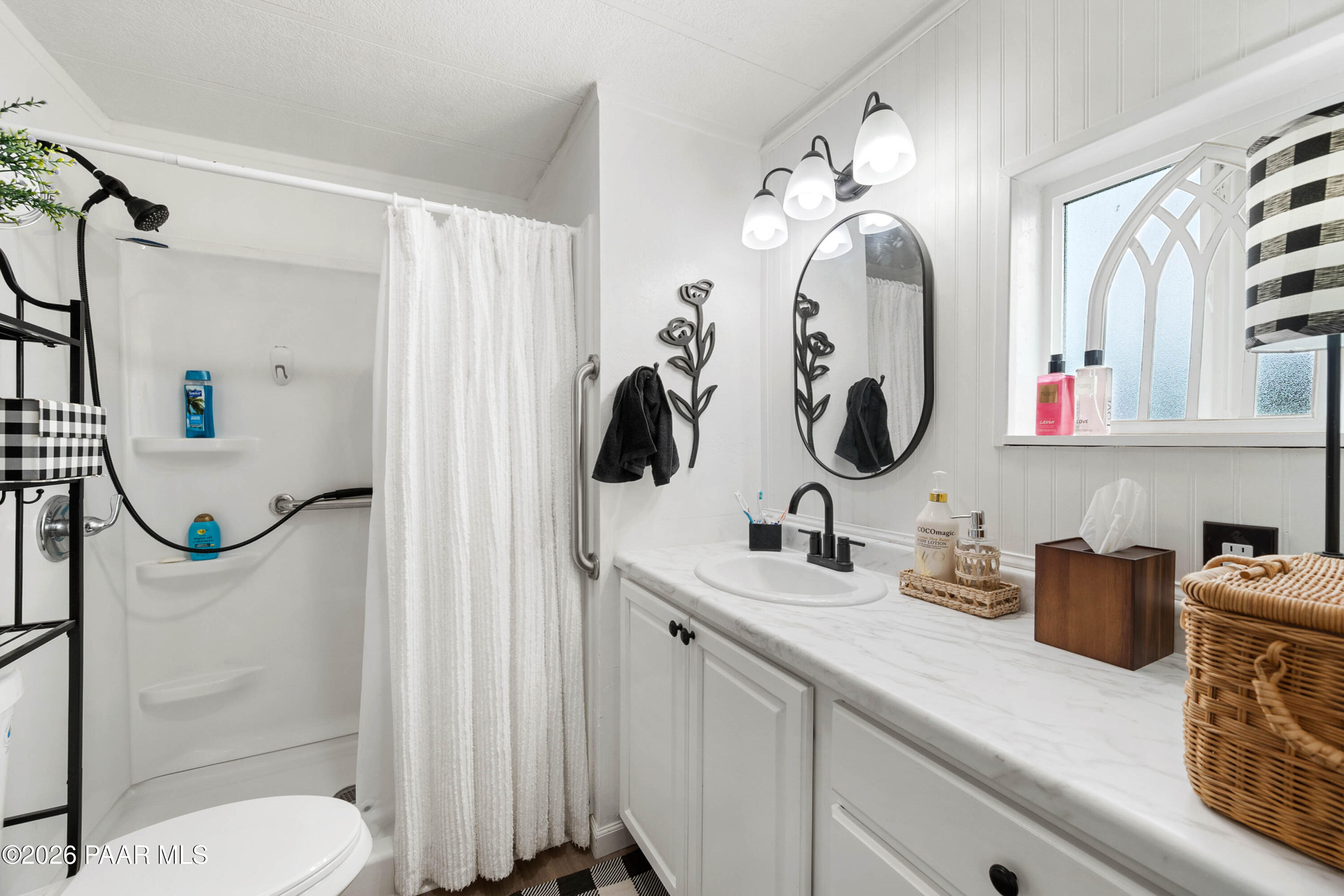1165 Rocking M Lane Dewey, AZ 86327 - Photo 22 of 30 a bathroom with a toilet sink and mirror