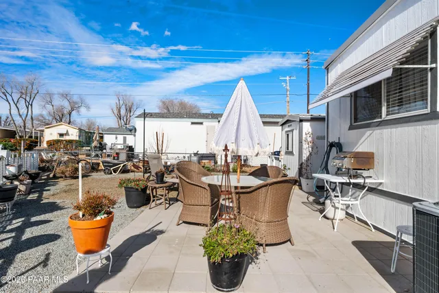 a view of a dinning table and chairs in the patio