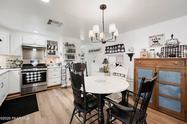 a view of kitchen with sink and wooden floor