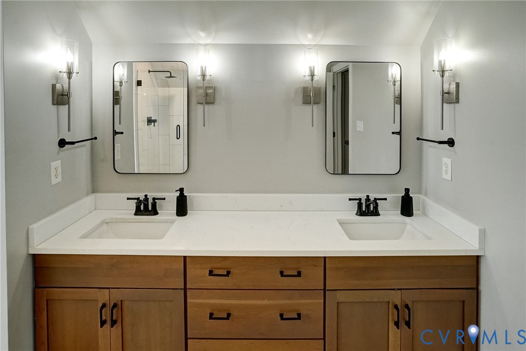 1295 Hermitage Road Manakin-Sabot, VA 23103 - Photo 44 of 55 a bathroom with double vanity sink and two mirror