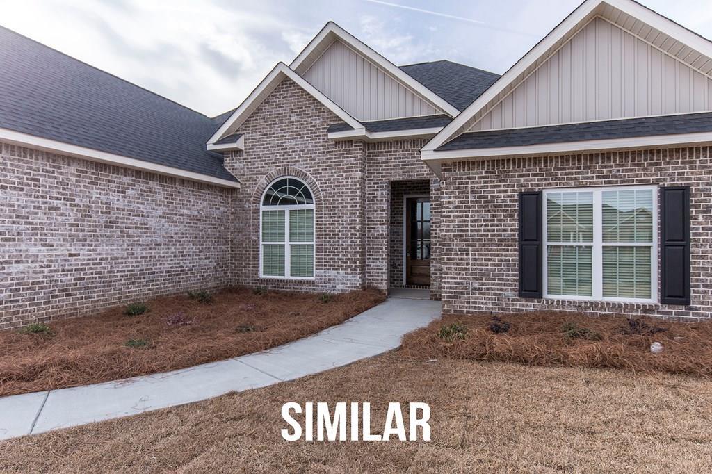 103 Timber Ridge Circle, Unit 139 Byron, GA 31008 - Photo 1 of 30 a front view of a house with a yard and garage