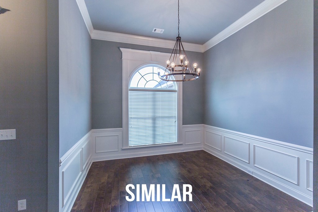 103 Timber Ridge Circle, Unit 139 Byron, GA 31008 - Photo 3 of 30 an empty room with wooden floor chandelier and windows