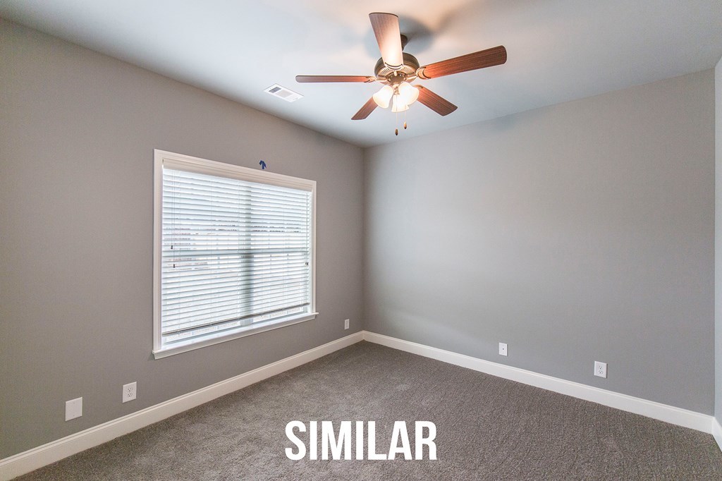 103 Timber Ridge Circle, Unit 139 Byron, GA 31008 - Photo 23 of 30 an empty room with windows and fan