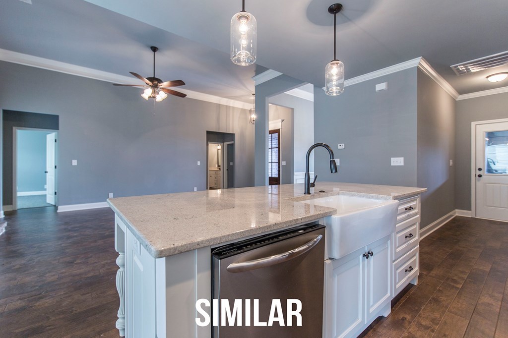 103 Timber Ridge Circle, Unit 139 Byron, GA 31008 - Photo 10 of 30 a kitchen with a sink a chandelier stainless steel appliances and wooden floor