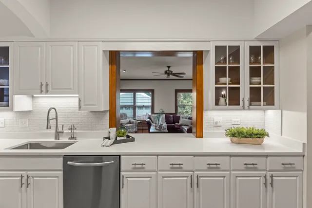 a kitchen with a sink and cabinets