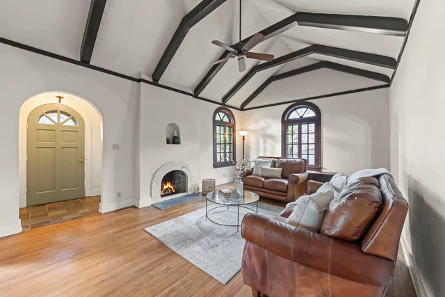 a living room with furniture and a fireplace
