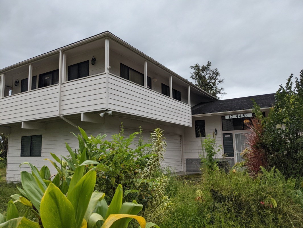 17-4455 S Road Mountain View, HI 96771 - Photo 3 of 5 a backyard of a house with plants and outdoor seating