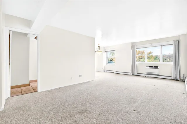 a view of a room that has a dresser in it