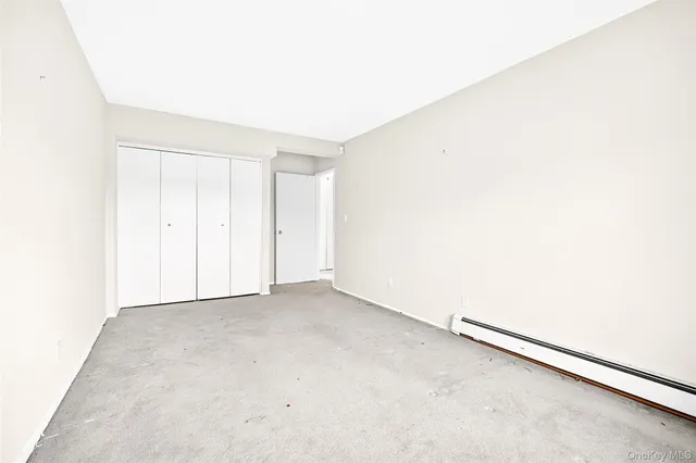 a car parked in parking space with parked cars