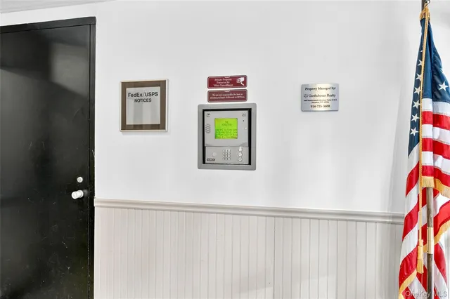 a view of a hallway with paintings on the wall