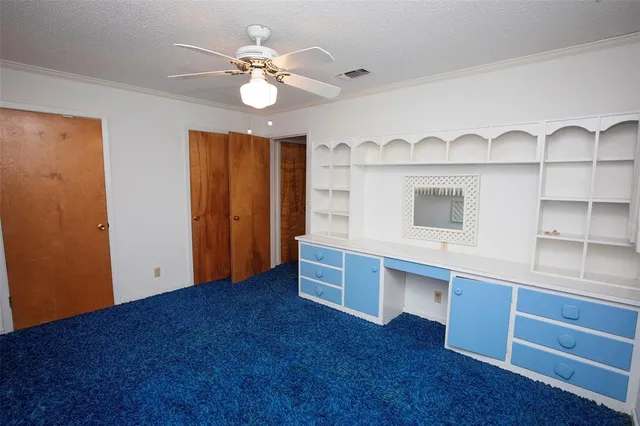 a room with window and ceiling fan