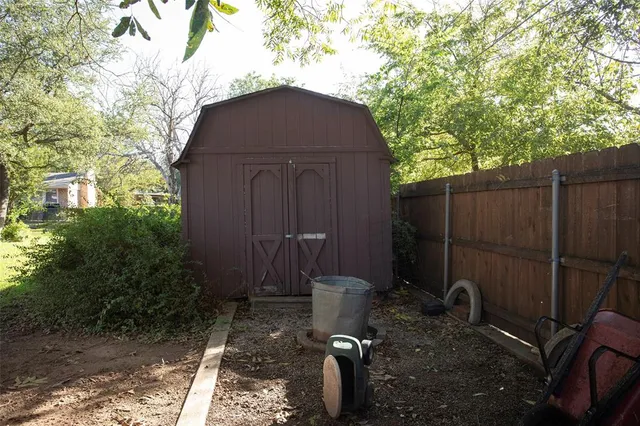 a view of backyard of house with green space