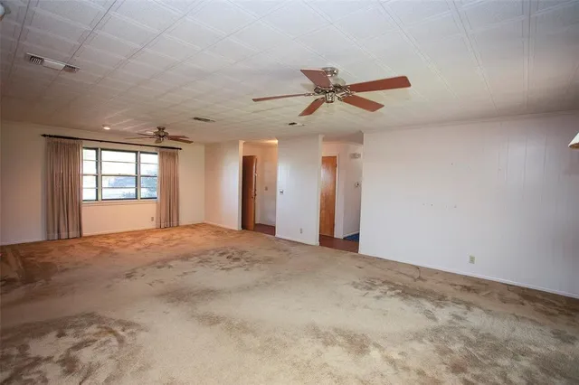 a view of empty room with windows