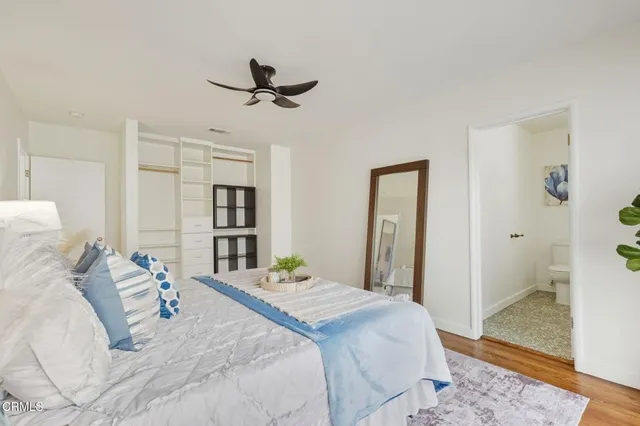 a bedroom with a bed and a view of bathroom