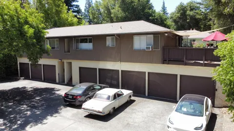 a car parked in front of white house