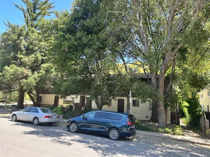 a view of street with parked cars