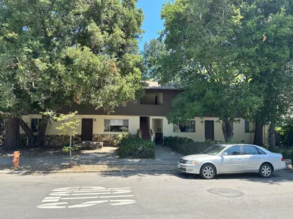 a view of street with parked cars