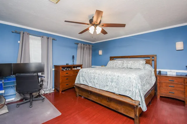a view of a hallway that has a dining table and chairs